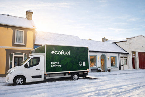 delivery truck with 'ecofuel' branding on a snowy street.
